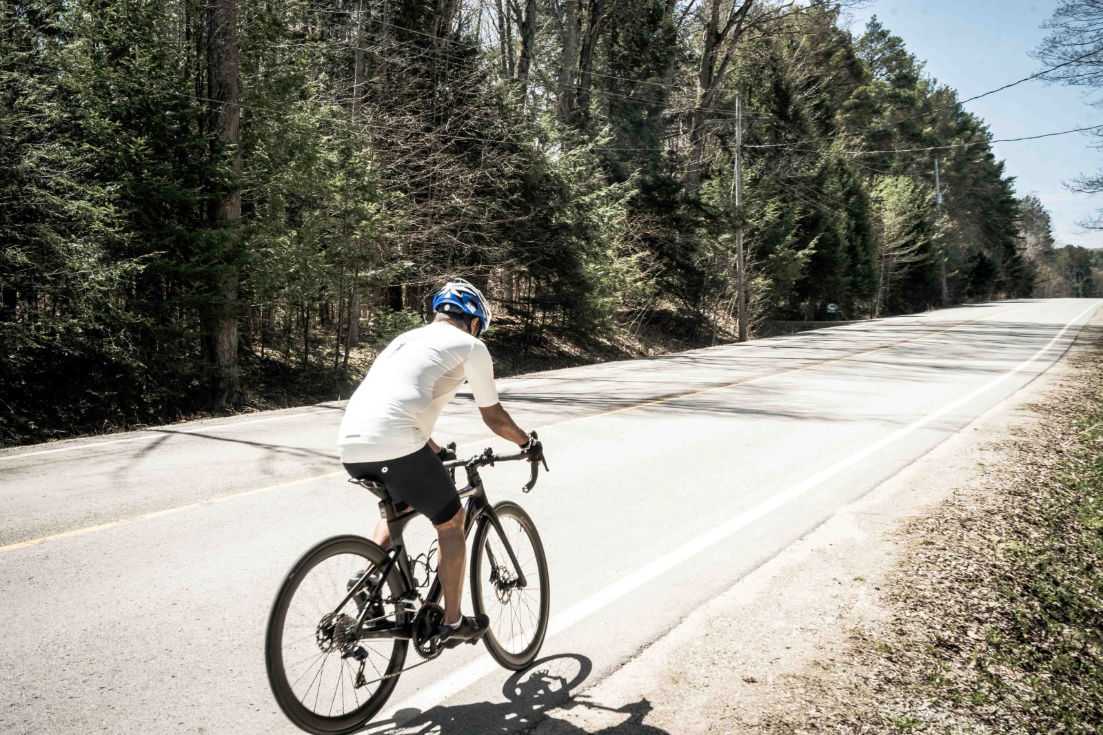 Cyclist riding on an open road during a Hope in Motion training ride